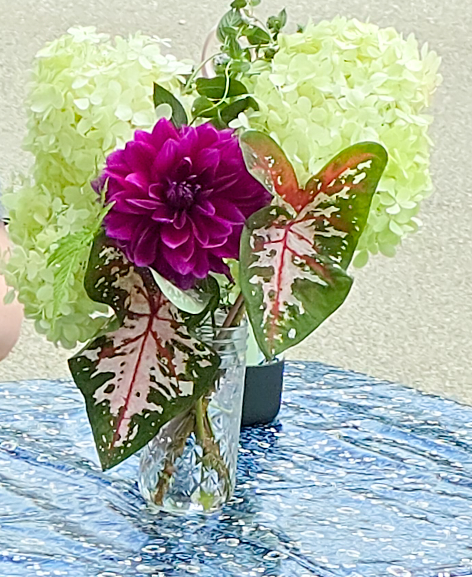 Purple dahlia with white hydrangeas