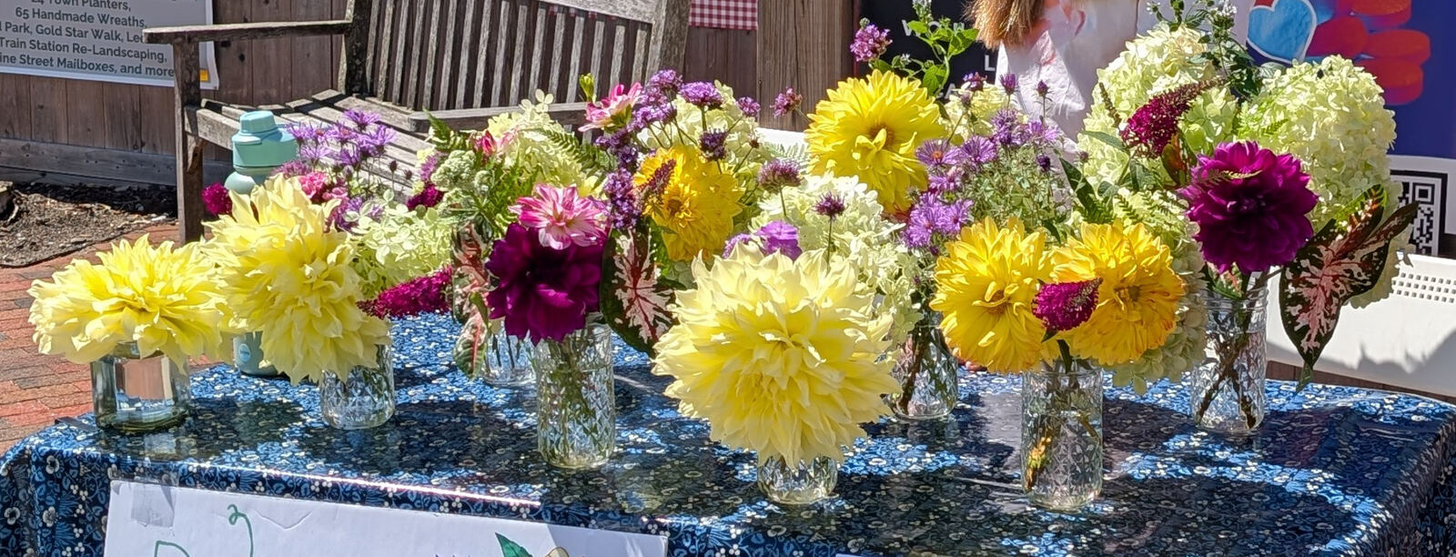 Dylan's beautiful dahlia bouquet display with yellow, purple and white blooms